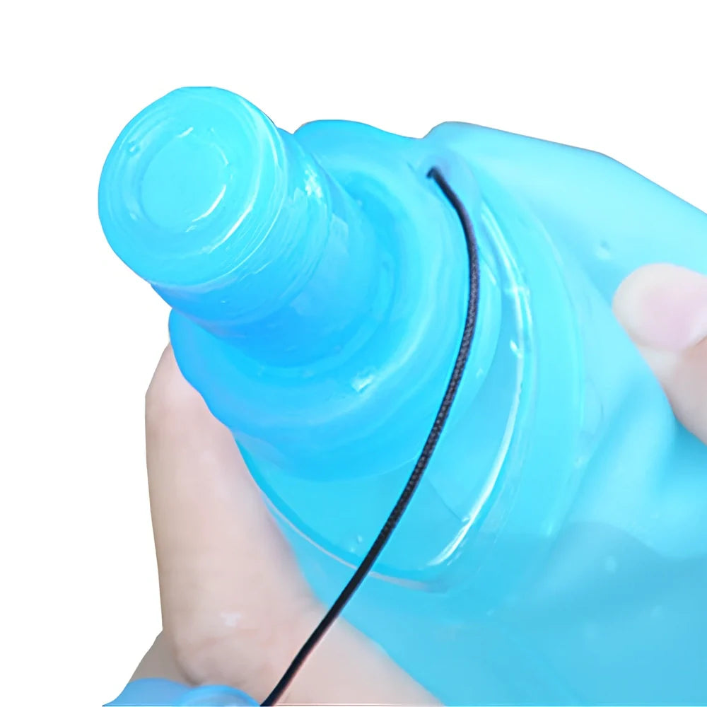 Sky blue folding TPU sports water bottle, 500ml capacity, leak-proof cap, collapsed view for portability