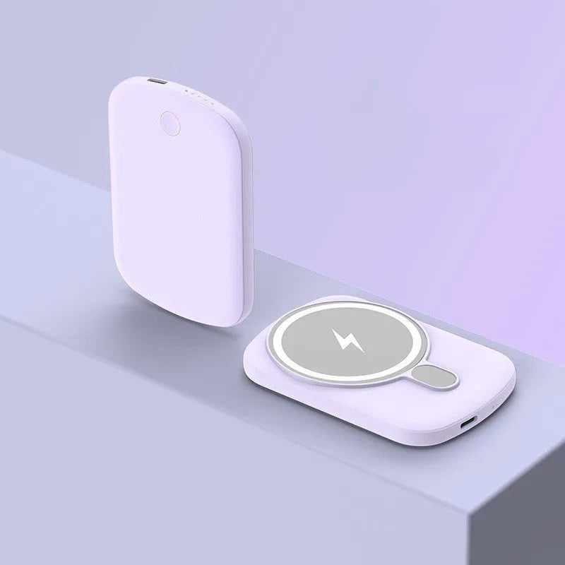 Magsafe magnetic wireless power bank in black, attached to an iPhone.