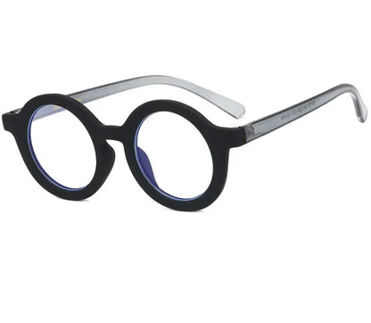 Retro round frame anti blue light glasses in various colours on a plain background