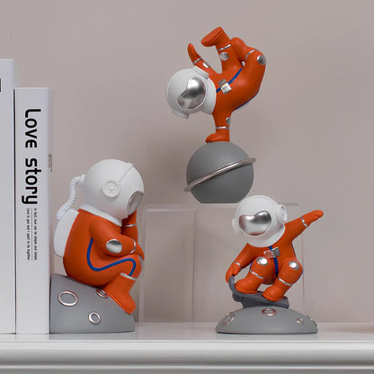 Hand-carved resin astronaut decoration in red or white with handstand, meditate, or skateboard poses