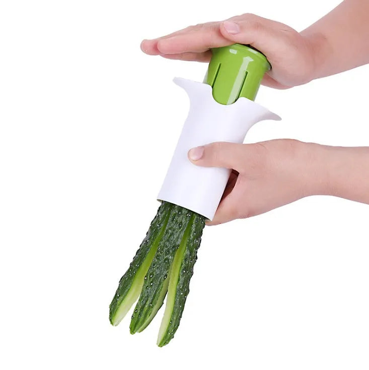 White plastic vegetable and fruit slicer with six stainless steel blades for cutting cucumbers and carrots.