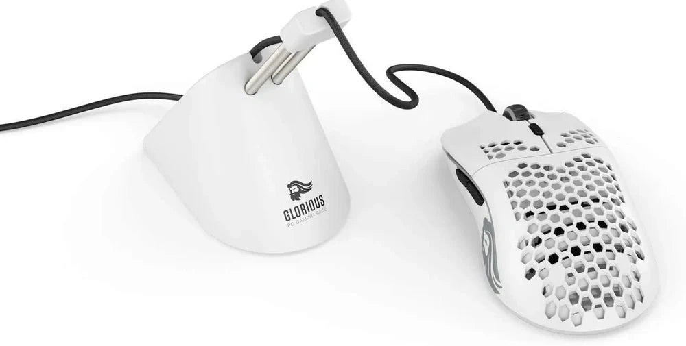 Black matte gaming mouse with hole design showing RGB lighting and ergonomic shape for right-handed use