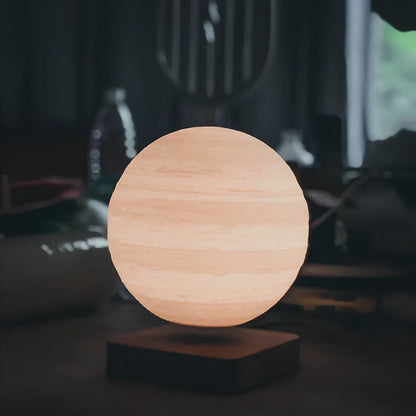 Magnetic levitation moon lamp with spherical design floating above base, showing three light colour modes