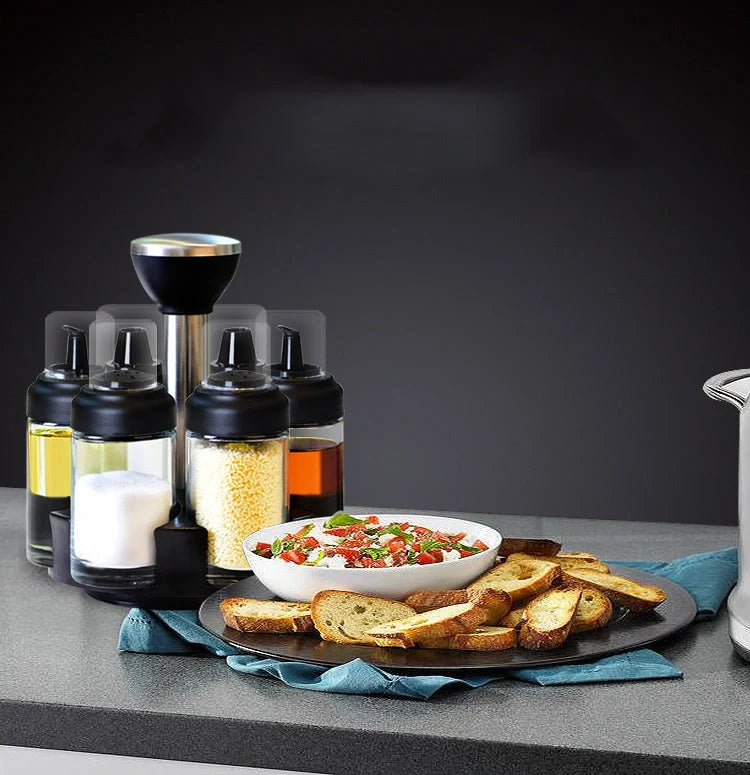 Glass rotating seasoning box set with anti-leakage design on kitchen counter