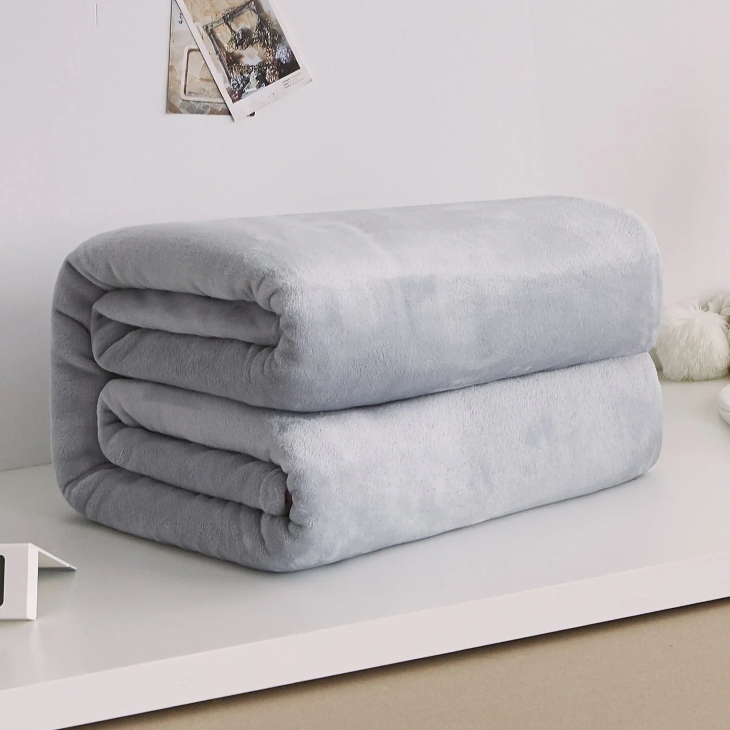 Coral fleece flannel blanket in beige showing textured surface and consistent edges