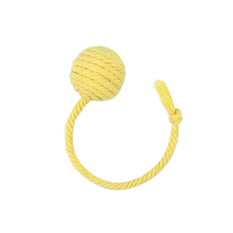 Interactive cat toy ball with bell and rope in green, pink, purple or yellow colours, shown in 3cm and 6cm sizes