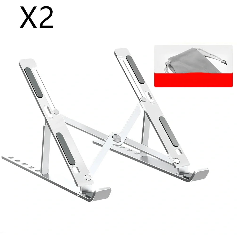 Silver aluminium alloy laptop stand folded slim, supporting 17.3-inch device with ventilation gaps and non-slip pads