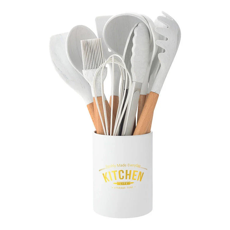 A set of silicone cooking utensils with sturdy wooden handles, designed to withstand high heat up to 446°F.