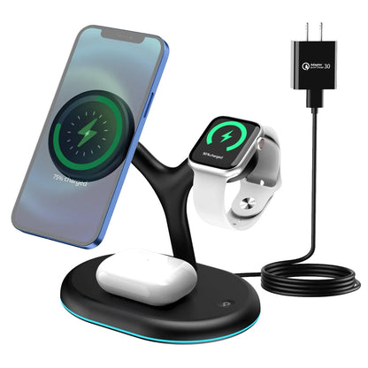 Black three-in-one magnetic wireless charger charging three devices simultaneously on wooden surface