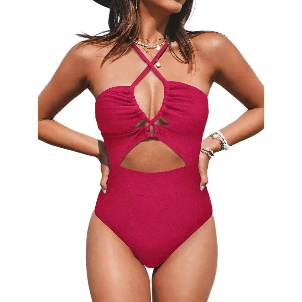 Black one-piece swimsuit on a model showing backless design