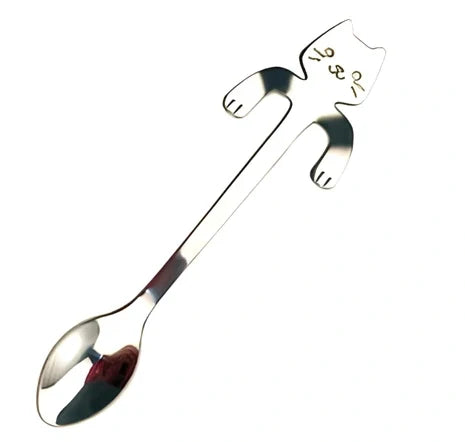 Stainless steel coffee spoon with cartoon cat handle design showing 11.7cm measurement scale