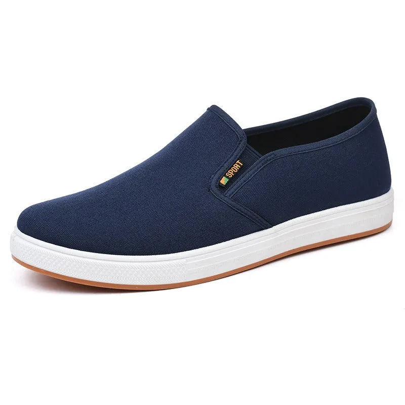 Men's low-top slip-on canvas casual shoes in black with a round toe and composite sole.