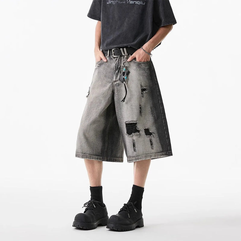 Women's denim shorts with a distressed hole design, made from high street water washed cotton fabric with micro elasticity in a cropped length and loose fit for a retro style summer outfit available in sizes S to 3XL in a classic grey colour