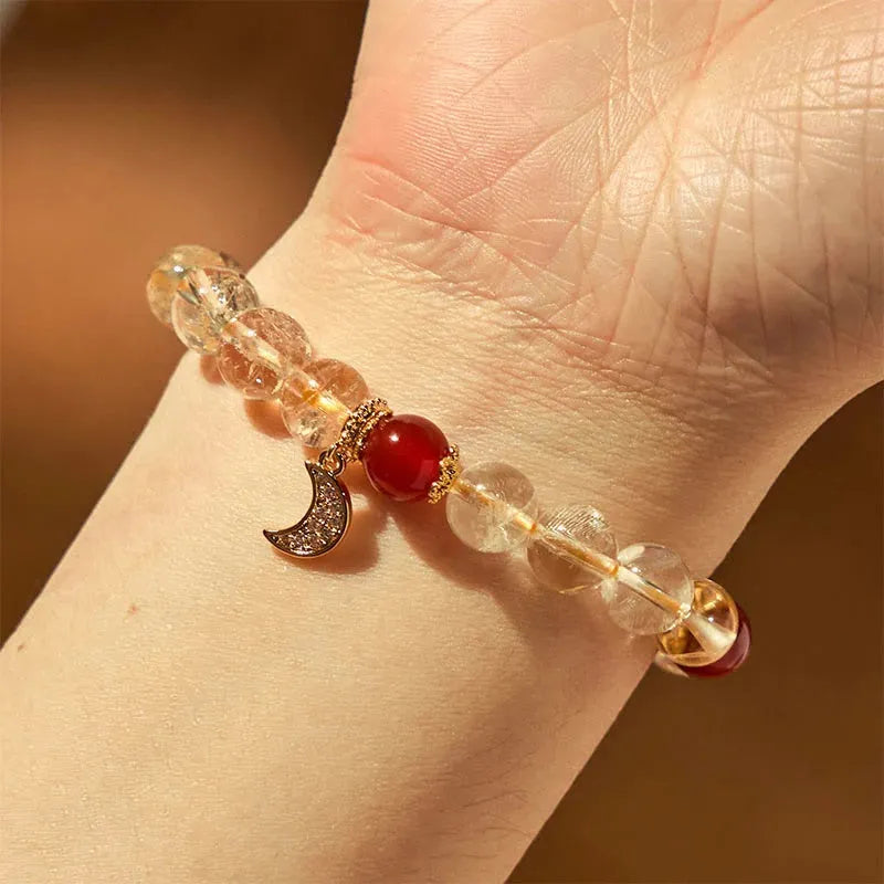 Citrine red agate moon boom crystal bracelet for women on a white background.
