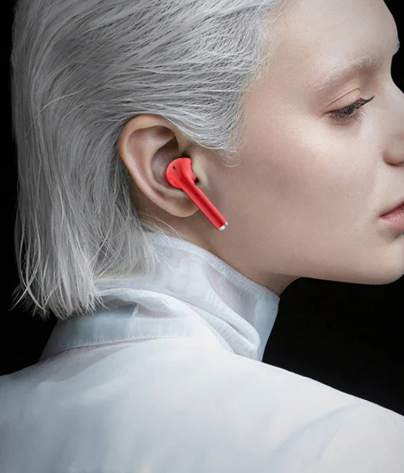 Stylish Bluetooth earbuds with lipstick-inspired design, noise cancellation, and comfortable fit for immersive audio experience