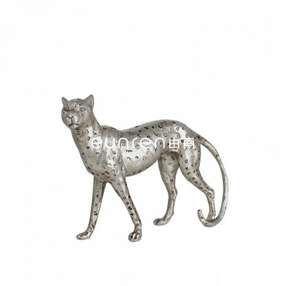 Leopard resin home ornament in American Leopard colour showing three pose variations on wooden surface