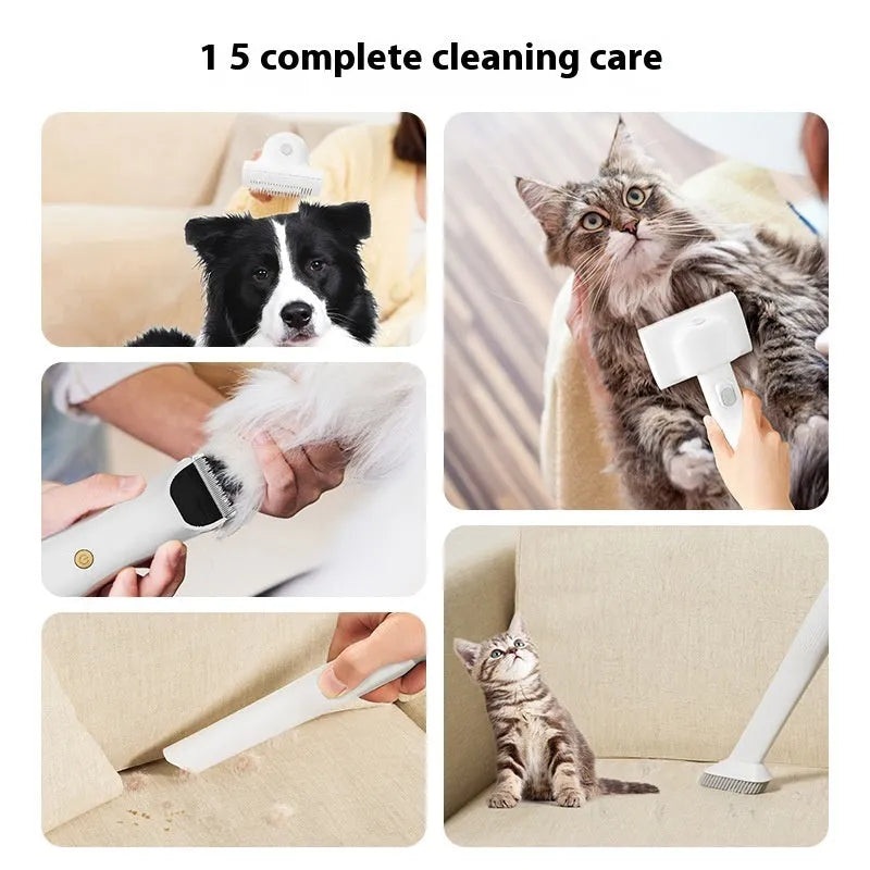 Pink and white pet grooming vacuum cleaner with shear attachment and accessories on a white background.