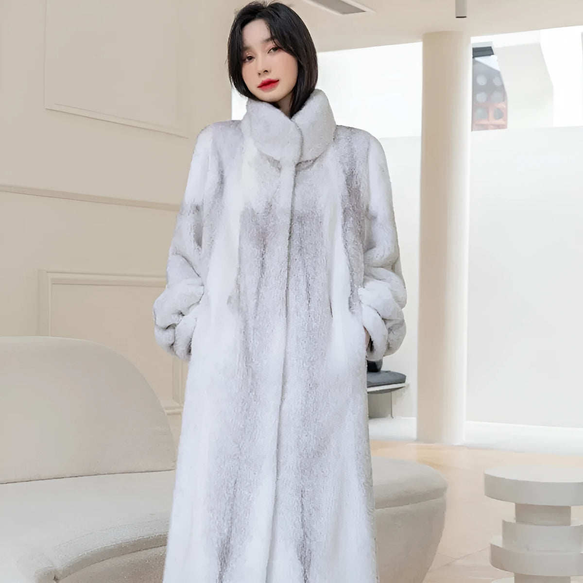 White women's faux fur coat with a stand-up collar, shown on a model.