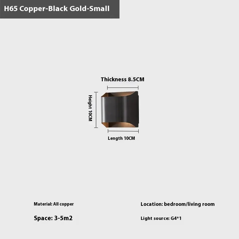Minimalist copper wall lamp in black gold finish mounted beside bed
