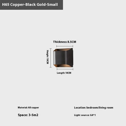 Minimalist copper wall lamp in black gold finish mounted beside bed