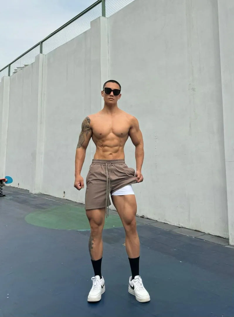 Men's ice silk quick-drying double-layer shorts in quarter-length design with nylon fabric