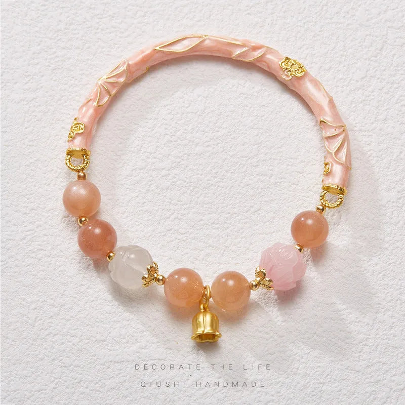 Chinese style sunstone and jade half bracelet with lily motifs measuring 20-24cm