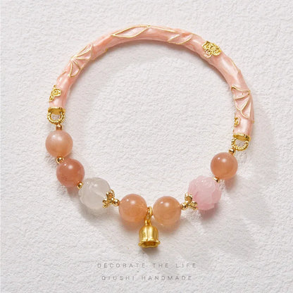 Chinese style sunstone and jade half bracelet with lily motifs measuring 20-24cm