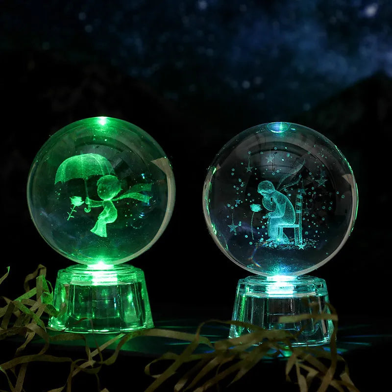 Transparent crystal ball ornament with inner carving of clouds, shown on a wooden table.