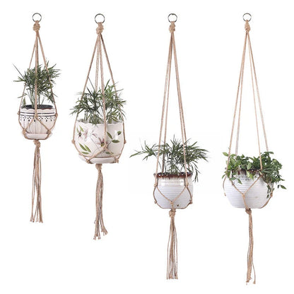 Hand-woven cotton rope hanging plant basket in natural jute, perfect for home decor.