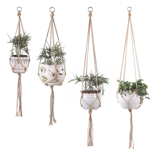Hand-woven cotton rope hanging plant basket in natural jute, perfect for home decor.