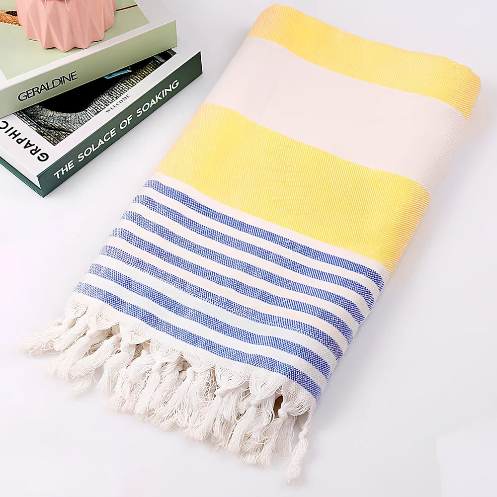 Striped Turkish beach towel showing blue and white pattern, measuring 100cm by 180cm
