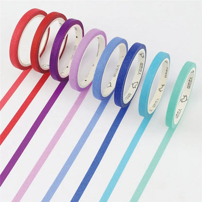 Two rolls of solid colour paper tape, one crimson and one deep purple, each 5mm wide.