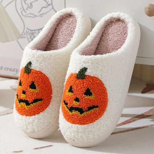 Pumpkin-shaped slippers in white and black colors, featuring a cozy cotton lining and non-slip rubber sole for comfortable indoor wear.