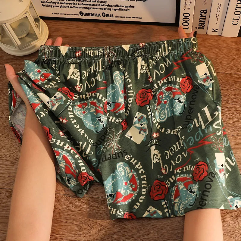 Men's grey printed cotton boxer shorts with mid waist and loose casual fit laid flat.
