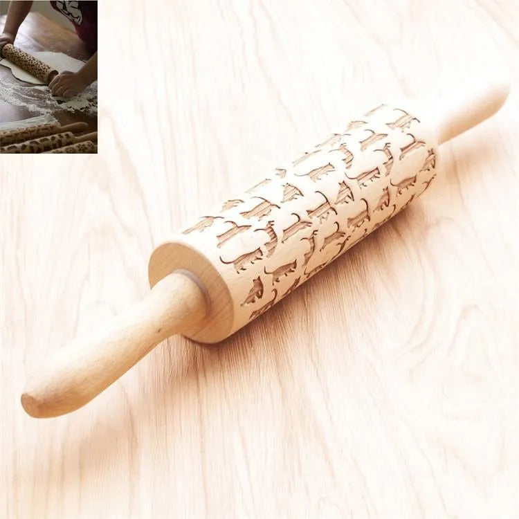 Wooden rolling pin with engraved Christmas patterns including reindeer and snowflakes on a 45cm long barrel.