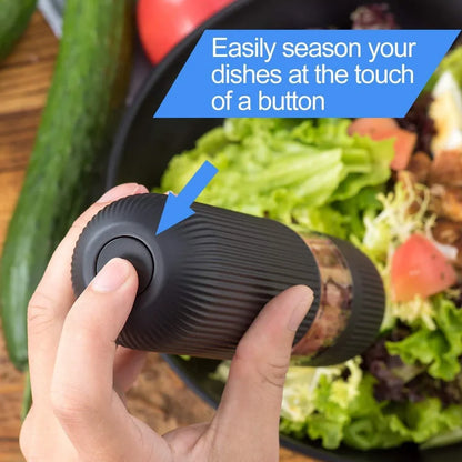 Black electric pepper grinder with transparent section showing peppercorns and ceramic grinding mechanism