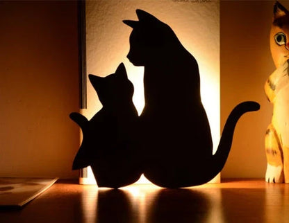 Assorted animal-shaped night lights with motion sensor, including a walking cat, mother and child cat, licking cat, looking back cat, and Pikachu