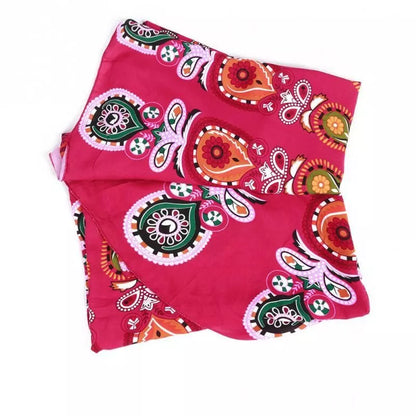 Mandala Red Round Beach Blanket with 57-inch diameter on sandy beach