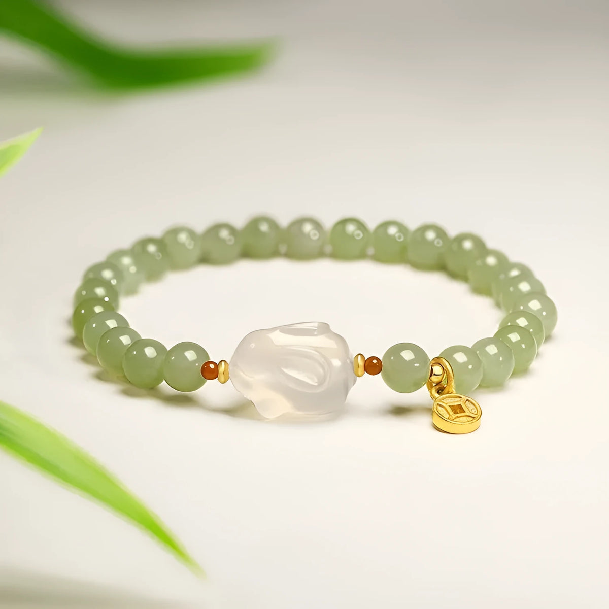 Handmade Hetian jade rabbit charm bracelet for women in glass or coloured glaze with a sweet rabbit design.