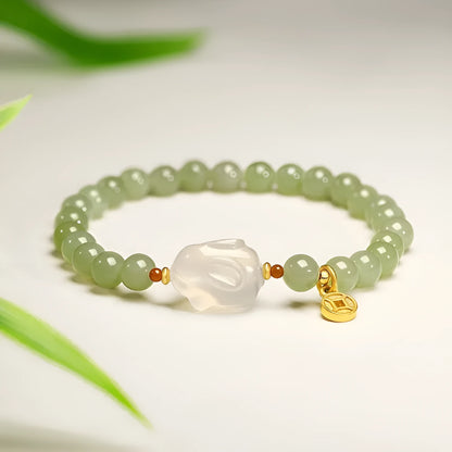 Handmade Hetian jade rabbit charm bracelet for women in glass or coloured glaze with a sweet rabbit design.