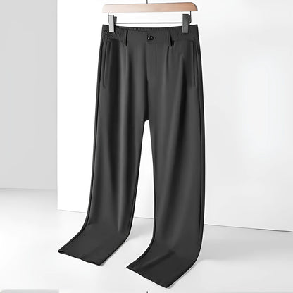 Men's black Ice Silk straight leg leisure trousers with elastic waistband laid flat