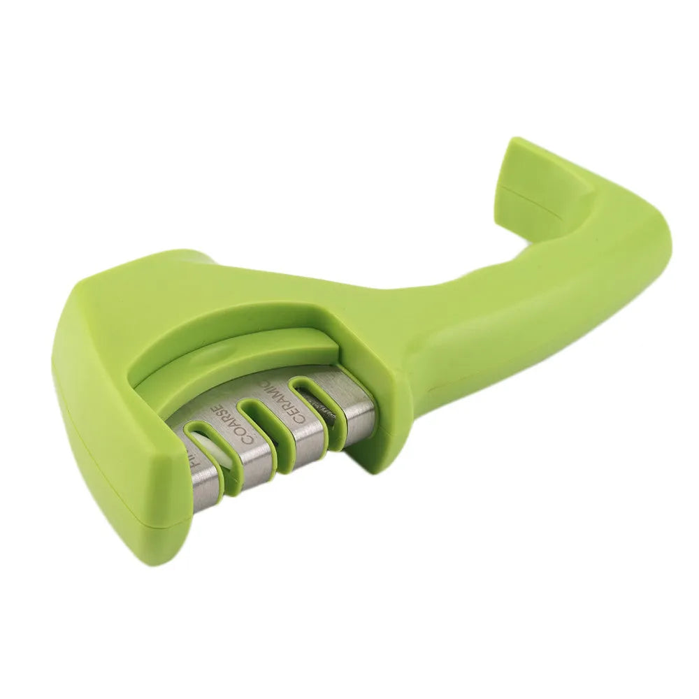 Black manual knife sharpener with three tungsten wire slots and rubber feet on base
