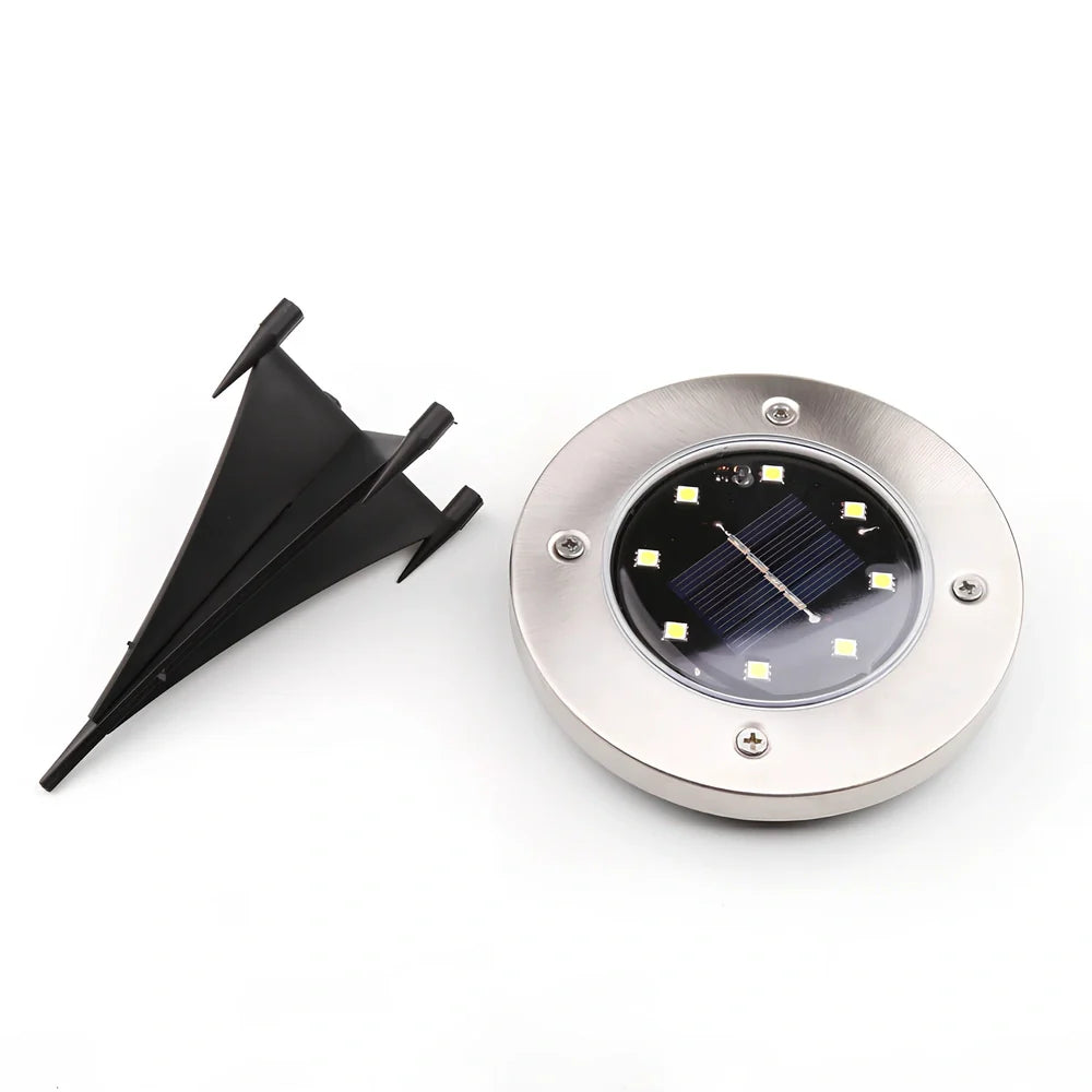 Stainless steel solar garden light measuring 11.5x11.5x13cm with automatic dusk operation