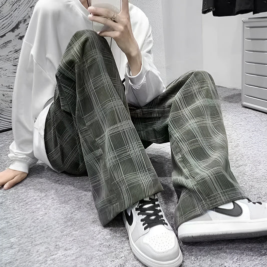 Men's black and green plaid straight leg trousers showing mid-waist design and six size options