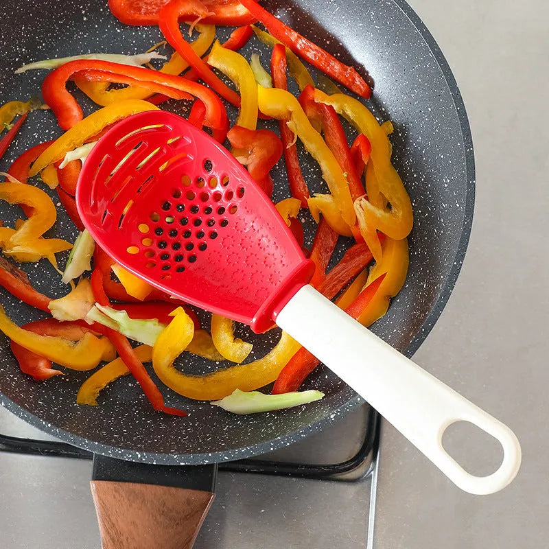 Red plastic multifunctional cooking spoon with serrated edge for grinding and half-enclosed scoop design