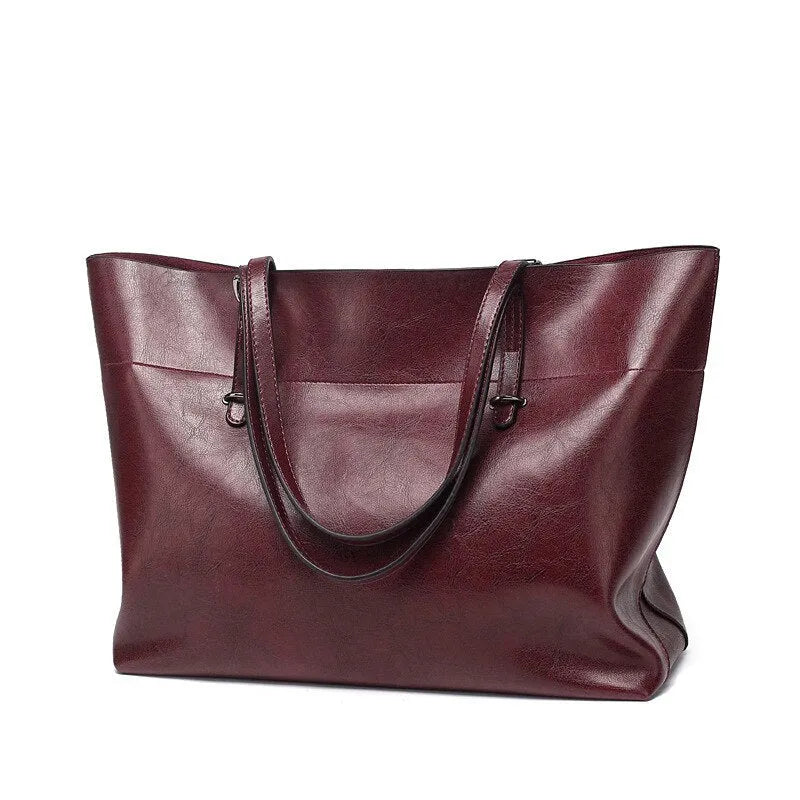 Leather cross-body handbag in Black colour with dimensions 30cm by 37cm by 13cm, showing internal pockets