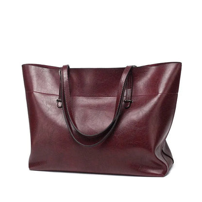 Leather cross-body handbag in Black colour with dimensions 30cm by 37cm by 13cm, showing internal pockets