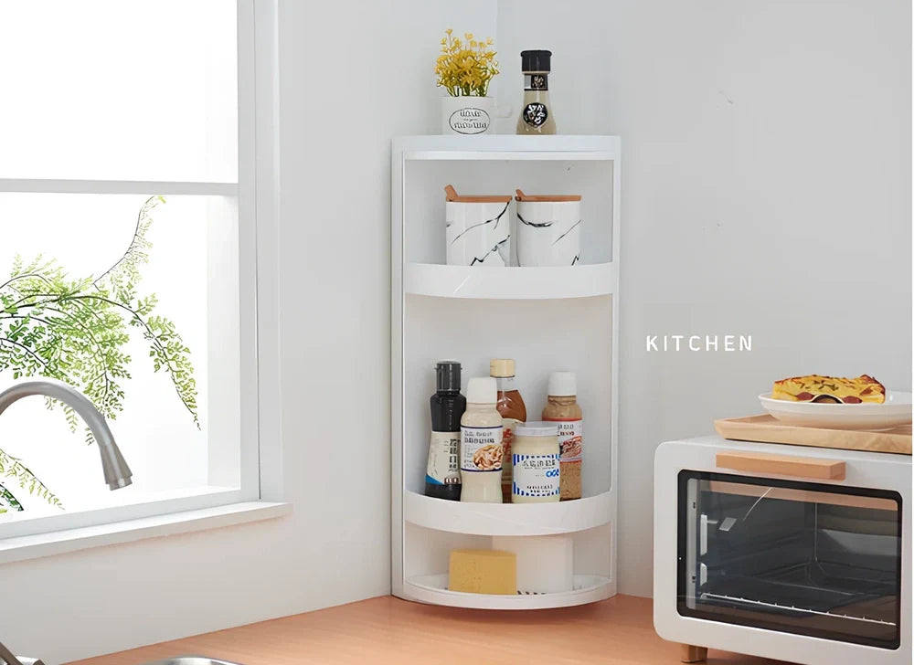 White triangle corner shelf with three tiers mounted in bathroom corner holding toiletries