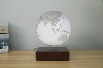 Levitating Earth or Jupiter lamp floating above base with LED illumination