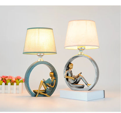 Blue reading night light with resin base and cloth shade measuring 20x39.8cm